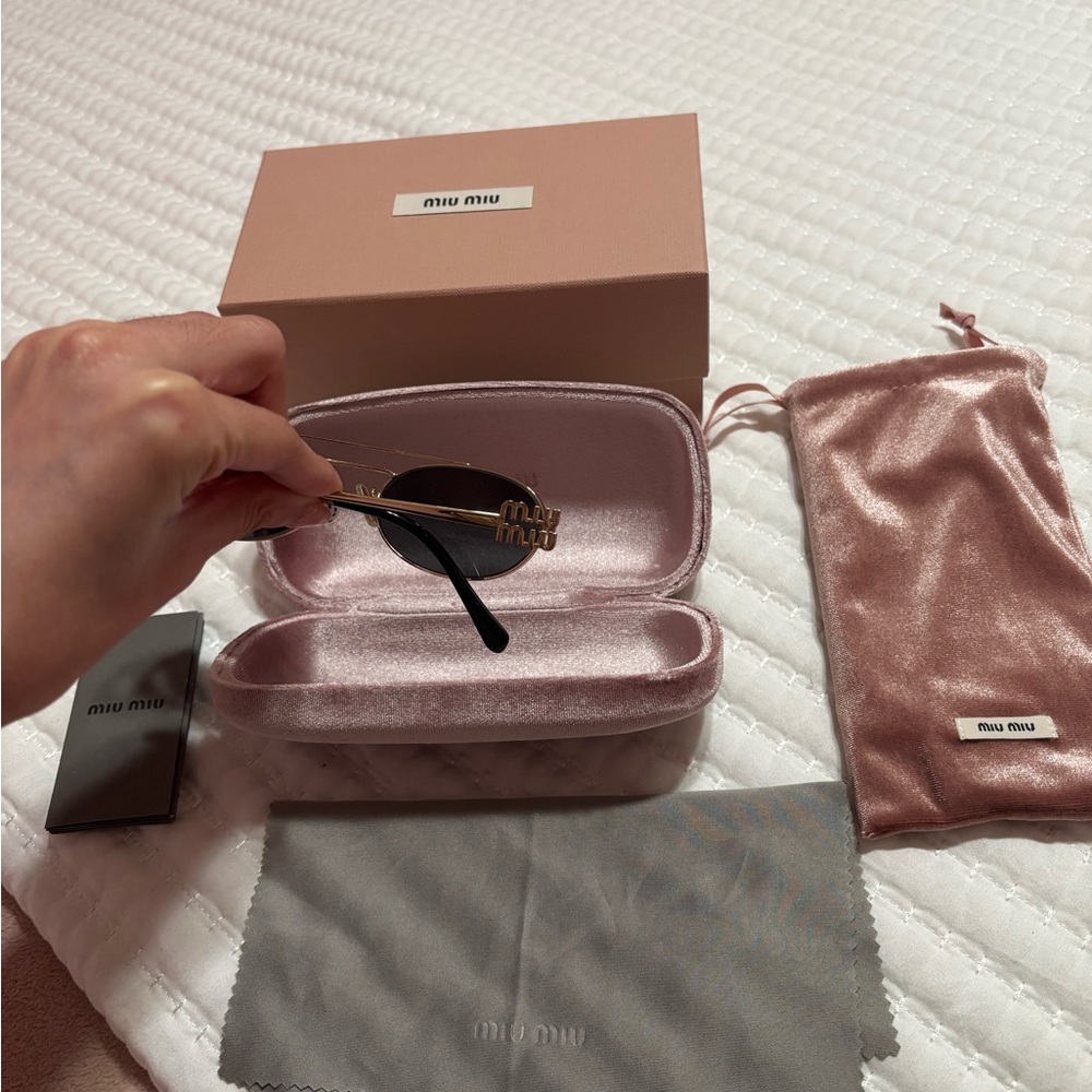 Miu Miu Gold and Black Oval Sunglasses